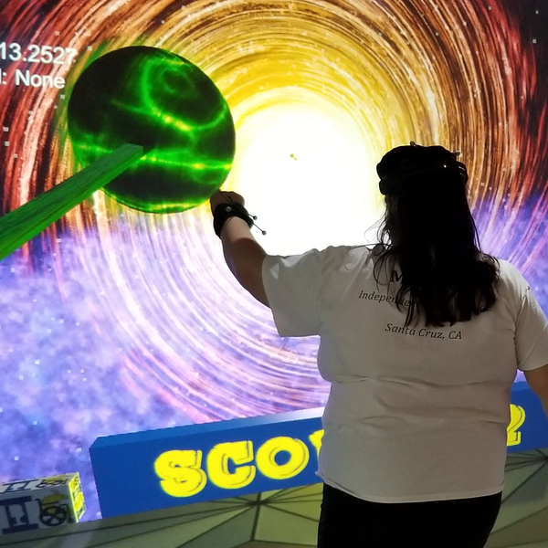 person playing space game in virtual reality